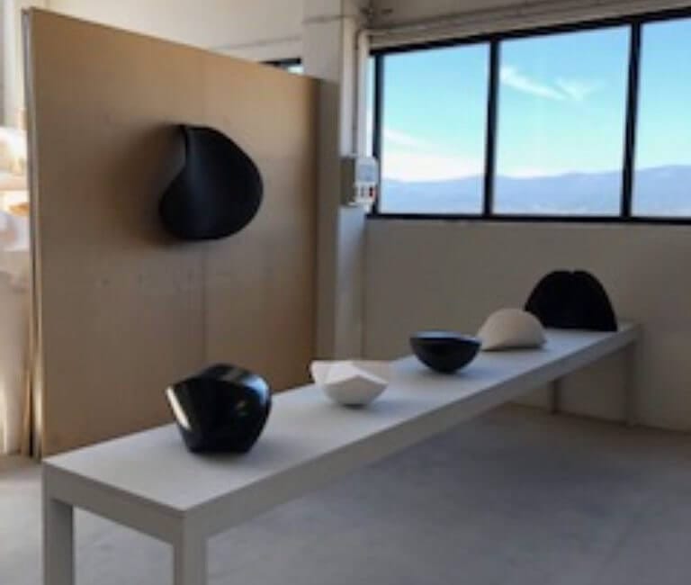 Sculptural art display featuring modern black and white pieces, exclusively at Chelsea Art Group - New York City top trusted art advisers.