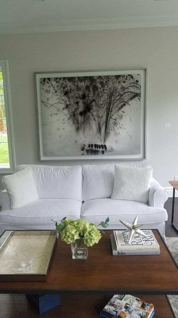 Contemporary artwork above a white sofa in a modern living room, only available at Chelsea Art Group - New York City top trusted art advisers.
