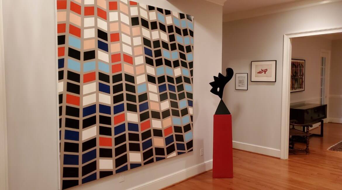 Abstract geometric painting and modern sculpture in a contemporary interior, available at Chelsea Art Group - New York City top trusted art advisers.