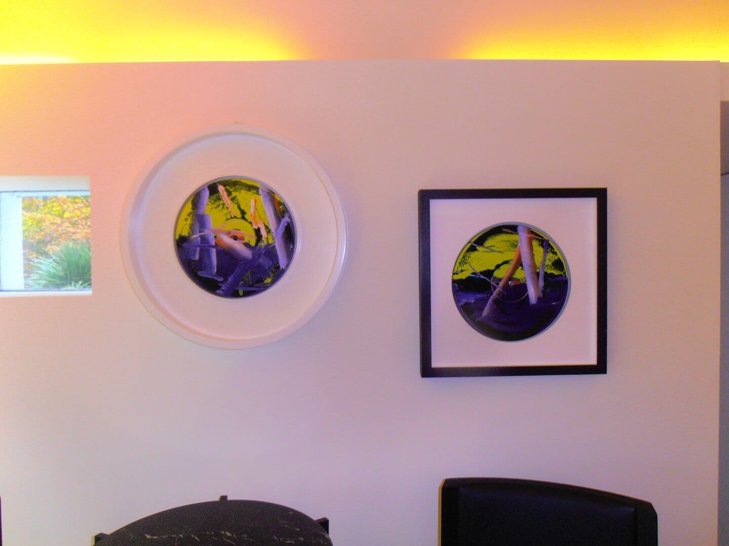 Artwork display featuring abstract circular designs, available at Chelsea Art Group - New York City top trusted art advisers in conceptual, drawing, painting, photography, and sculpture.