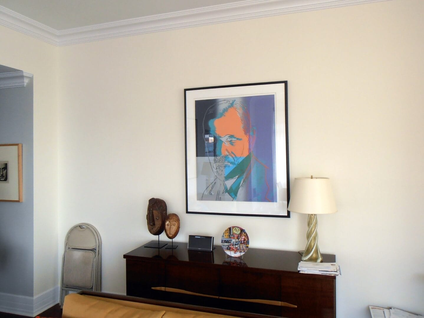 Colorful portrait and tribal masks in modern interior, only available at Chelsea Art Group - New York City top trusted art advisers in conceptual, drawing, painting, photography and sculpture.