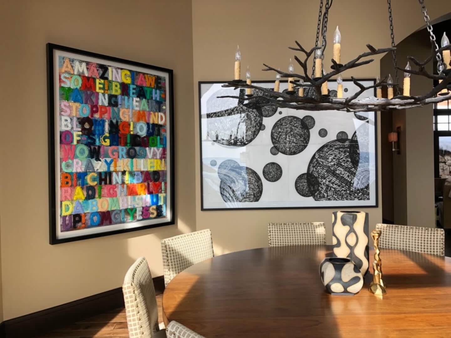 Colorful word art and abstract circle design in elegant dining room, available at Chelsea Art Group - New York City top trusted art advisers.