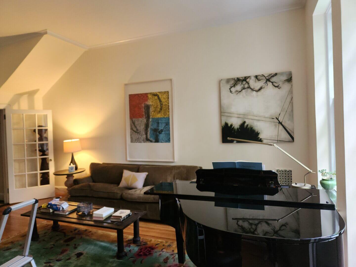 Cozy living room with abstract art by Susan Rothenberg and Katherine Bowling, available at Chelsea Art Group - New York City top trusted art advisers.
