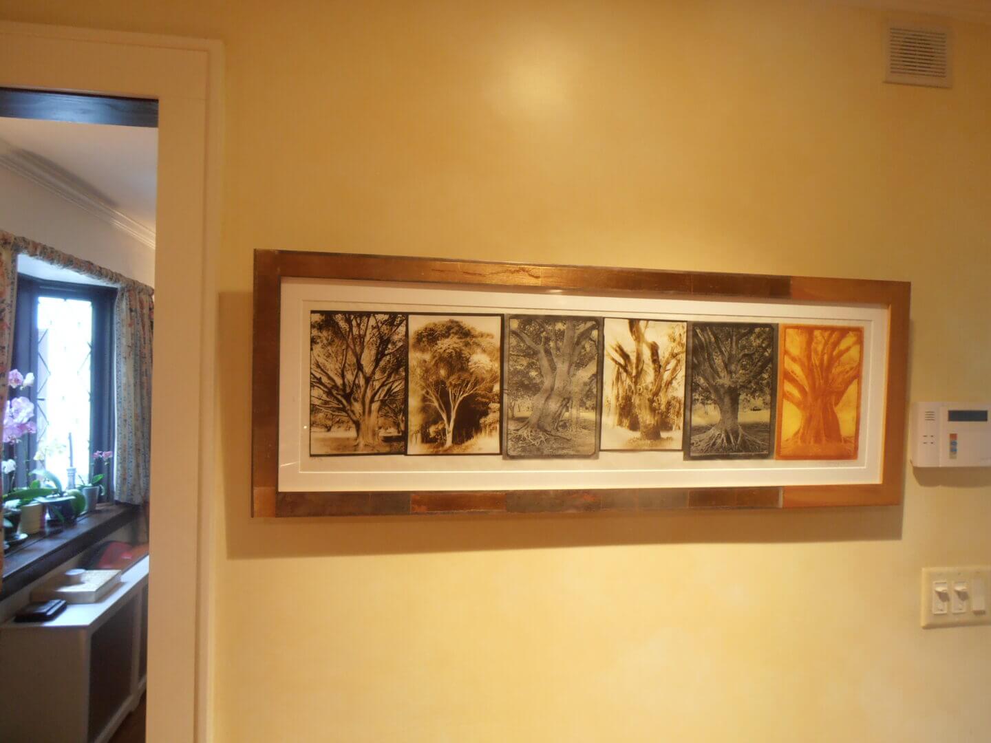Framed artwork with tree designs on a wall, available at Chelsea Art Group - New York City top trusted art advisers in conceptual, drawing, painting, photography and sculpture.