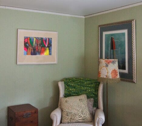 Cozy art-filled interior with colorful paintings and elegant decor, available at Chelsea Art Group - New York City top trusted art advisers in conceptual, drawing, painting, photography and sculpture.