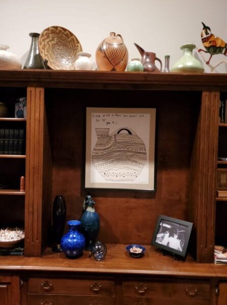 Elegant wooden shelf displaying pottery and art pieces, only available at Chelsea Art Group - New York City top trusted art advisers in conceptual, drawing, painting, photography and sculpture.